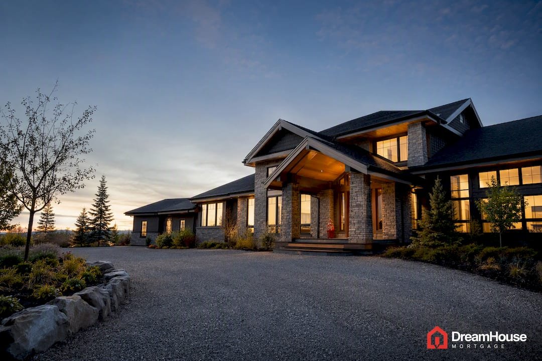 Luxury Calgary acreage home at dusk
